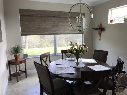 Horizon Woven Wood Roman Shade in Dining Room
