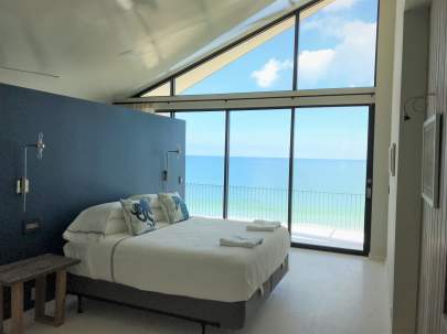Ocean view bedroom window no curtains