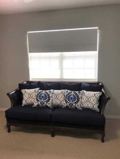 Blue couch with pillows