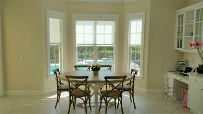 Roller shades in breakfast nook windows