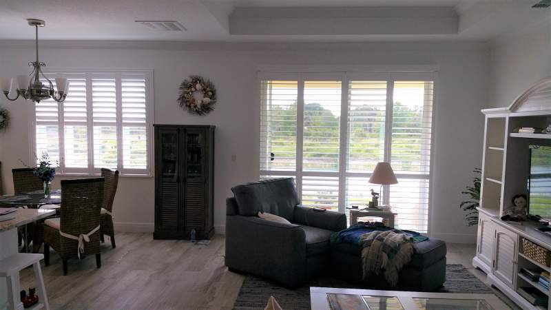 norman bifold shutter on slider and matching shutter in window in the open position