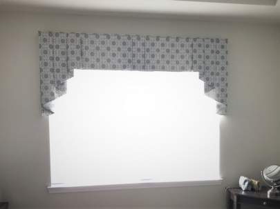 Bedroom window with day shade and valance