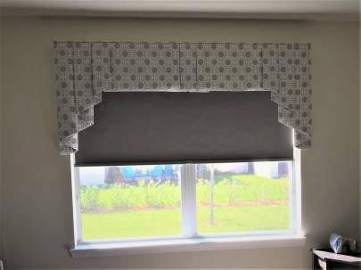 Bedroom window with black out shade and valance