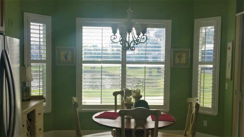 Norman window shutters in breakfast nook