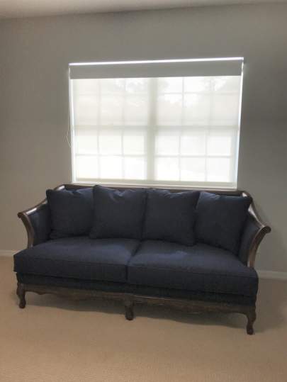 Blue couch with no pillows
